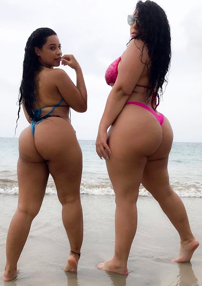 Two Latin girls with big ass on the beach in sexy bikini ...