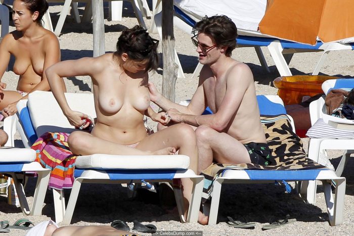 Daisy Lowe topless on the beach in Ibiza