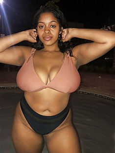 Plump black bitch shows her huge boobs in her new swimsuit
