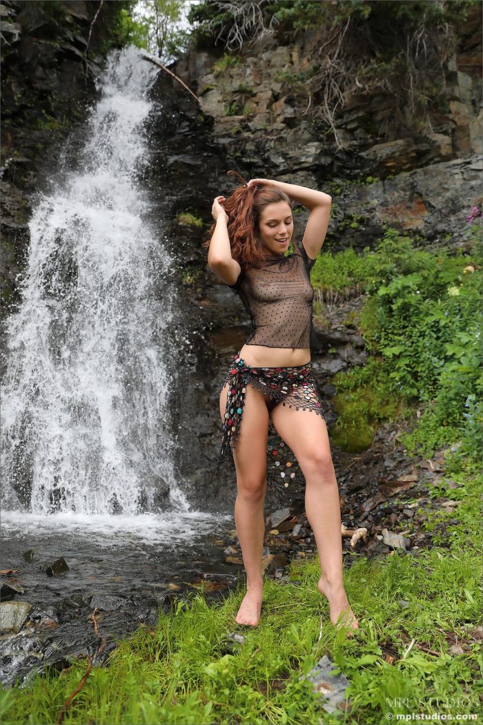 Beautiful brunette Elena Generi posing nude outdoors in the nature at the waterfall-02