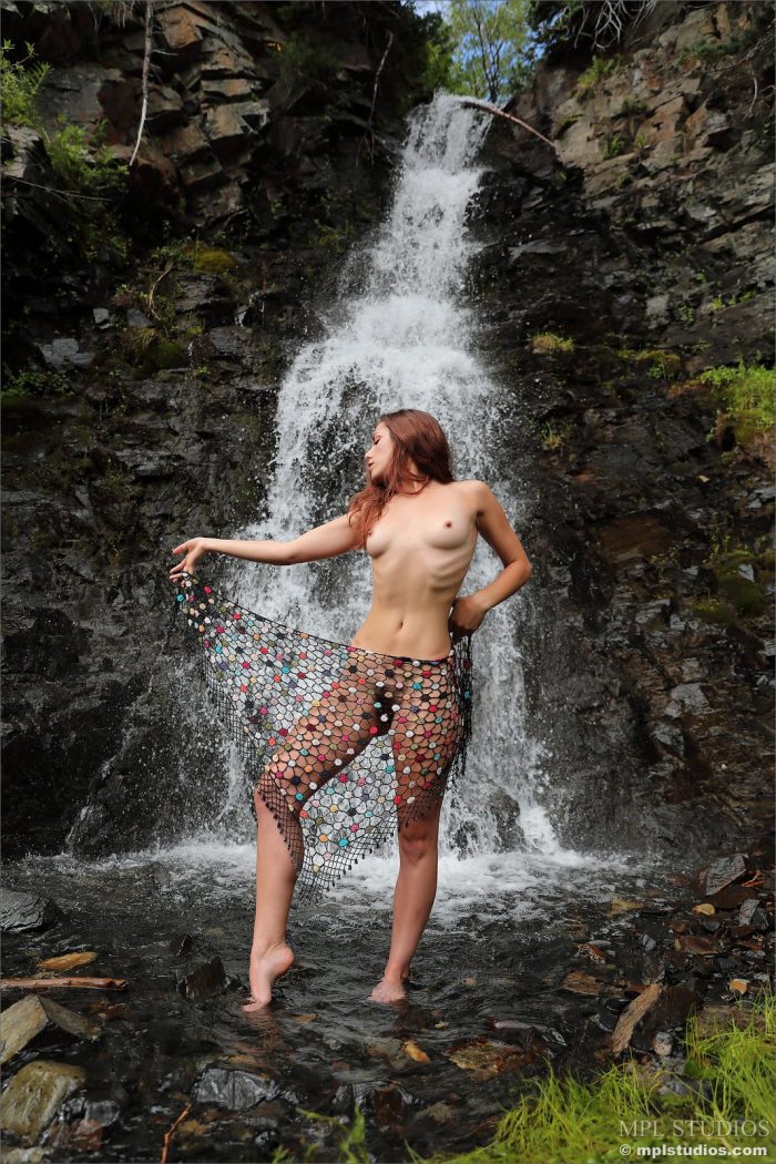 Beautiful brunette Elena Generi posing nude outdoors in the nature at the waterfall-11