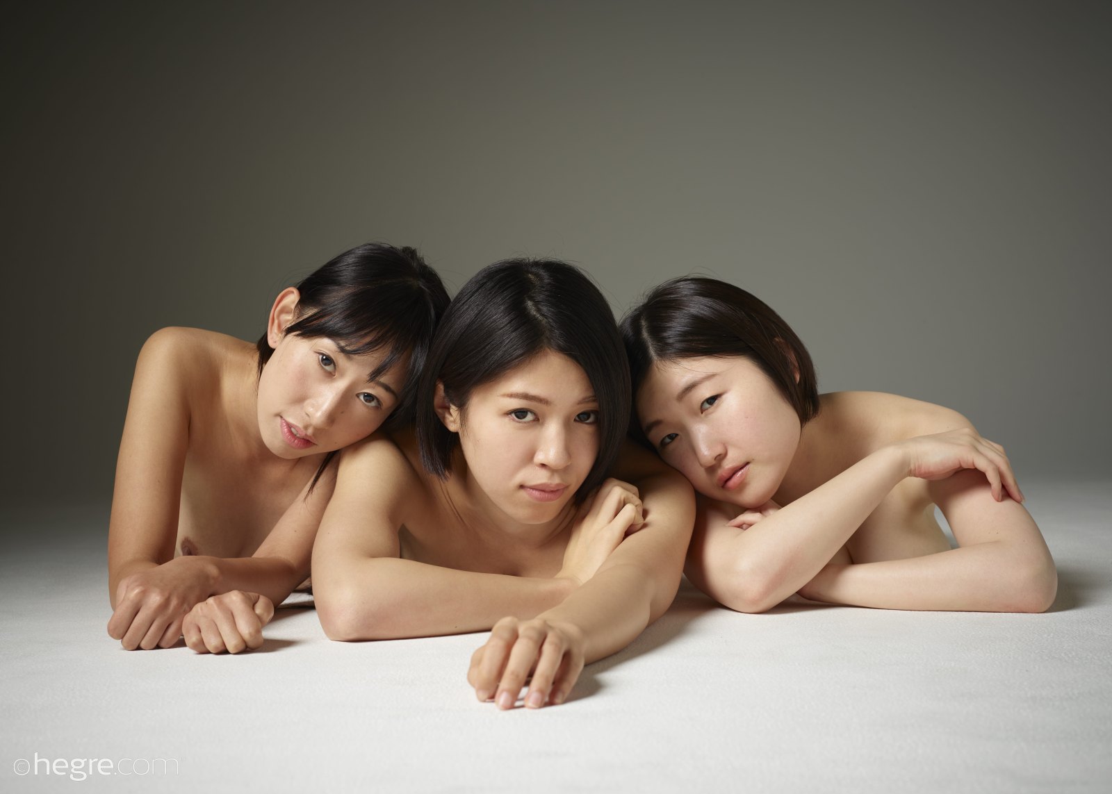 Three beautiful Asian dols sensually pose naked together SexPin