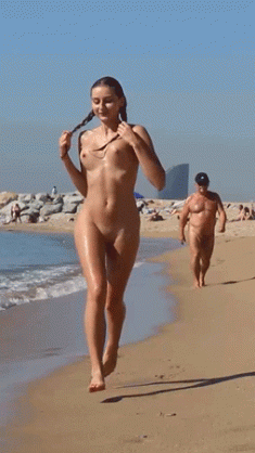 Naked girl running on the beach